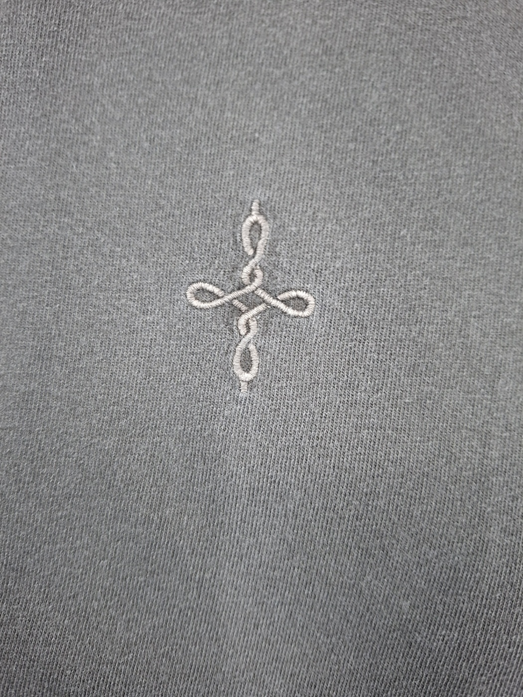 Knot symbol embroidery on an UNDERKNOT physical sample, received September 6