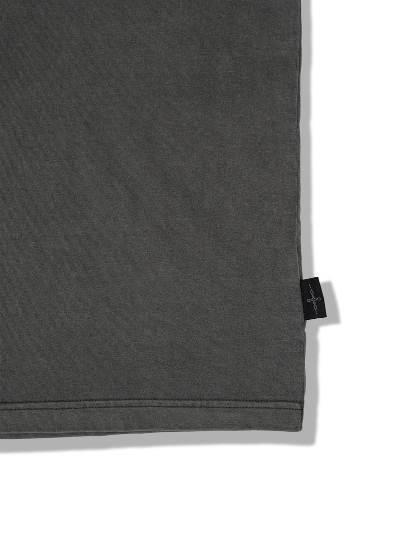 HEAVYWEIGHT TEE in FADED GRAPHITE, first production run — Side tag (studio, September 2026)