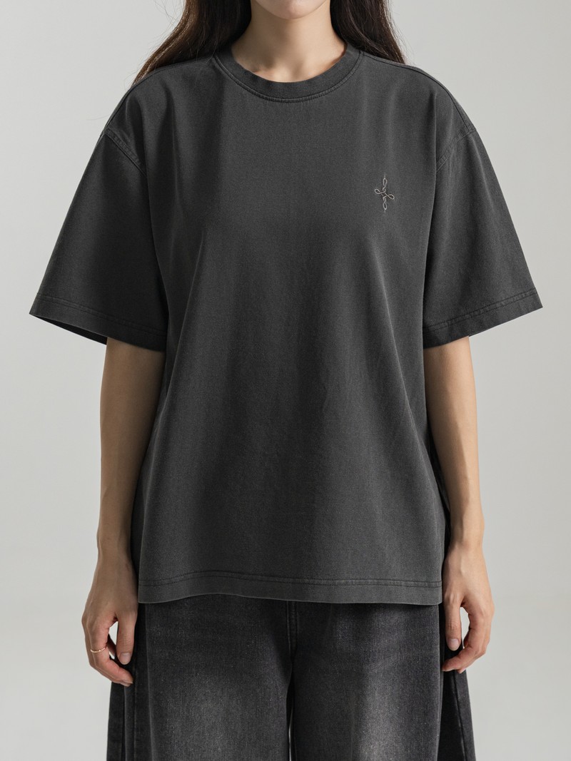 HEAVYWEIGHT TEE in WASHED CHARCOAL, first production run — Worn · female torso (studio, September 2026)