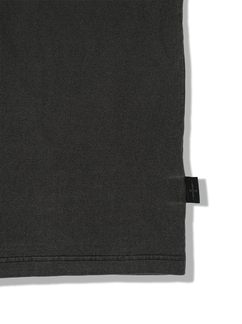 HEAVYWEIGHT TEE in WASHED CHARCOAL, first production run — Side tag (studio, September 2026)
